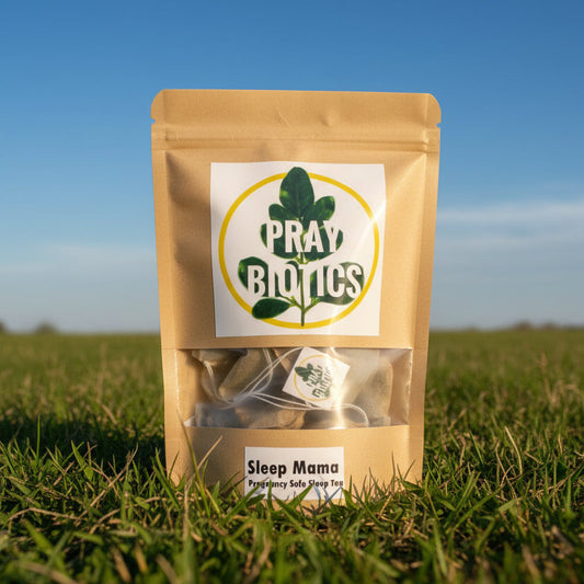 Package of 'Sleep Mama' product with 'PrayBiotics' label on grass